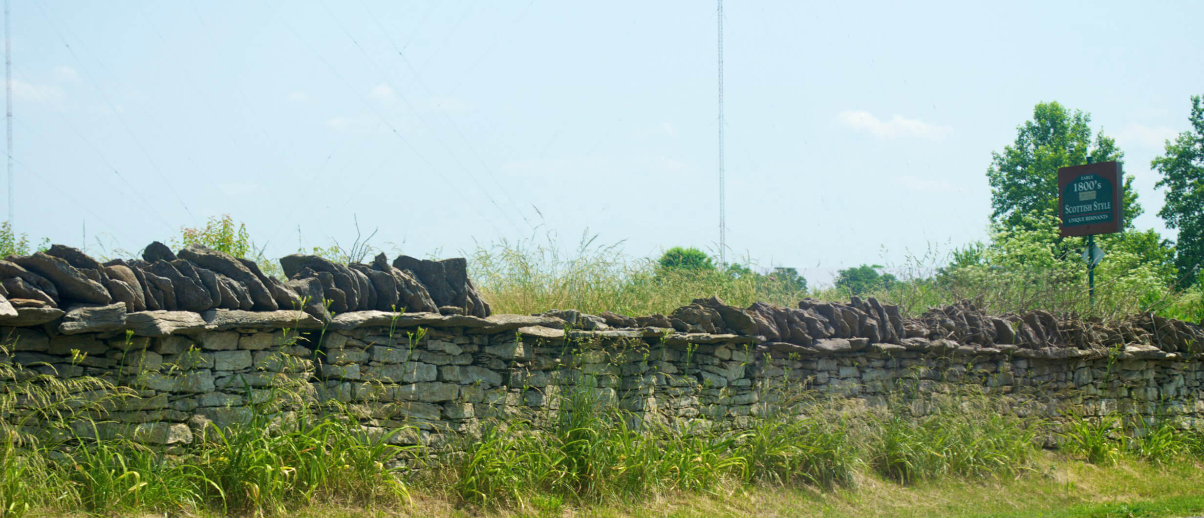 Stone Fence with 1800 Scottish Sign 2